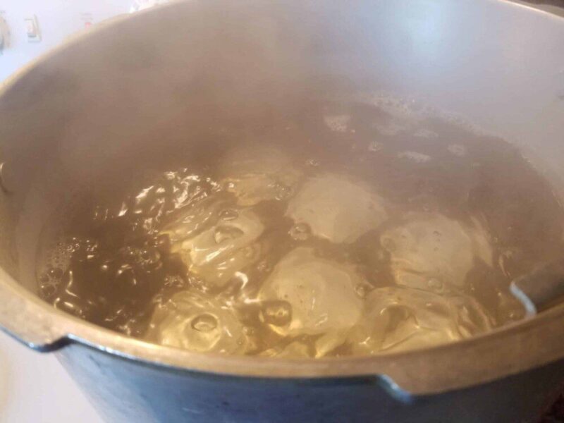 Image of canning pot with jars and boiling water.